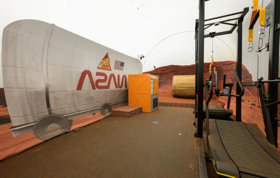 The sandbox portion of the Crew Health and Performance Exploration Analog habitat contains equipment such as a treadmill for use during virtual reality traverses. Bill Stafford/NASA